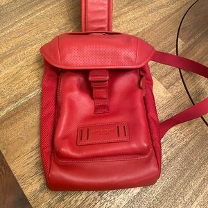 Coach sling backpack.. beautiful rich red used for only a week at most.